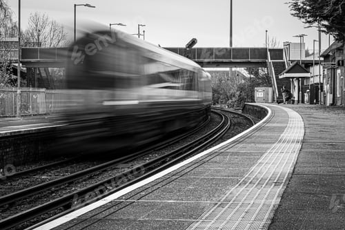 Preview: Grayscale shot of a train caught in motion