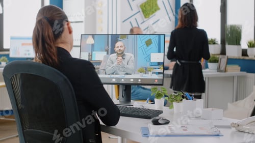 Preview: Businesswoman using video call on computer for conversation