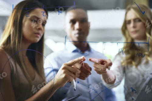 Preview: Shot of a group of young businesspeople brainstorming in a modern office