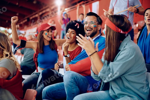Preview: Group of sports fans having fun while cheering during the match at the stadium.