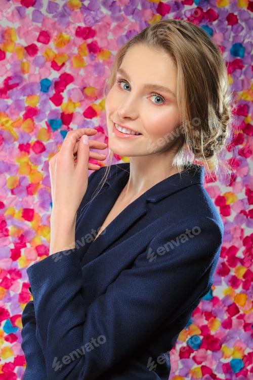 Preview: Portrait of pretty model in classic jacket claping her hands on vibrant flower background