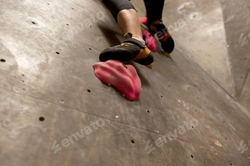 Preview: foot of woman exercising at indoor climbing gym