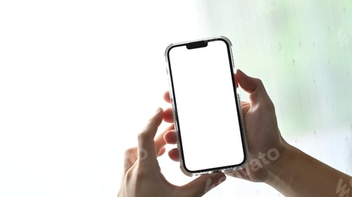 Preview: Man hands holding smart phone. Blank screen for your webpage or advertise text.