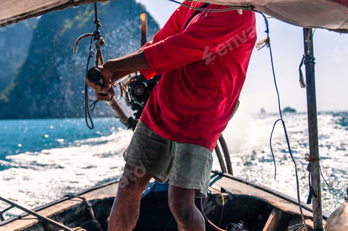 Preview: A boat skipper navigating the sparkling seas