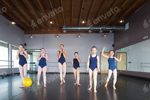 Preview: Group of happy girls laughing and playing in dance studio