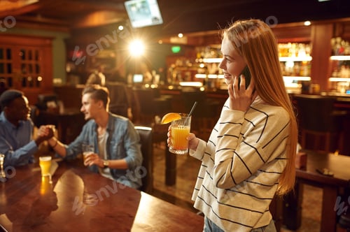 Preview: Friends with alcohol beverages having fun in bar