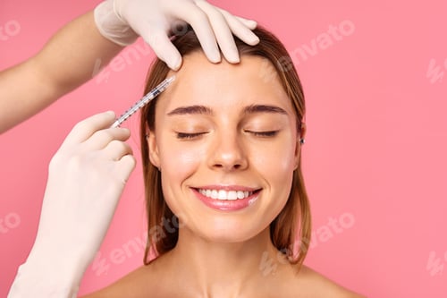 Preview: A woman is receiving a facial treatment at a salon to achieve a glowing and youthful look