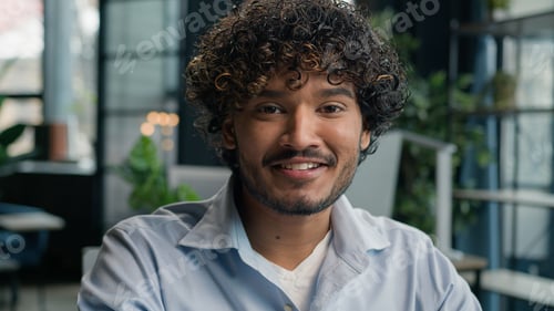 Preview: Business portrait Indian arabian man smiling male businessman cheerful guy gen z working on laptop