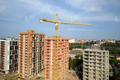 Preview: Aerial view of tall residential apartment buildings under construction. Real estate development