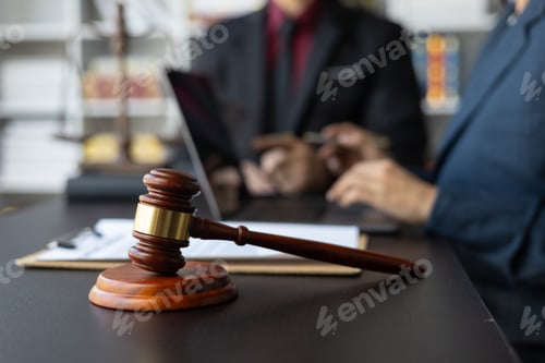 Preview: Businessman and lawyer discuss with legal advisor in lawyer's law office.
