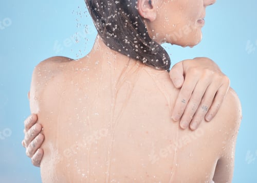 Preview: Back, woman and water splash for skincare, clean and hygiene against blue studio background. Young