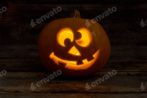 Preview: Funny Jack-O-Lantern with glowing candle.