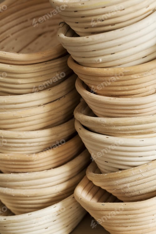 Preview: Close up of a stack of rattan proofing baskets.