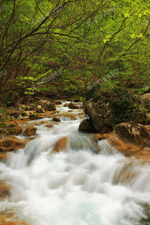 Preview: Beautiful autumn landscape with a waterfall in the autumn forest