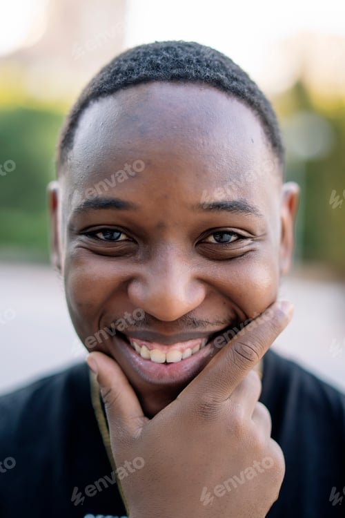 Preview: Smiling african man looking at camera