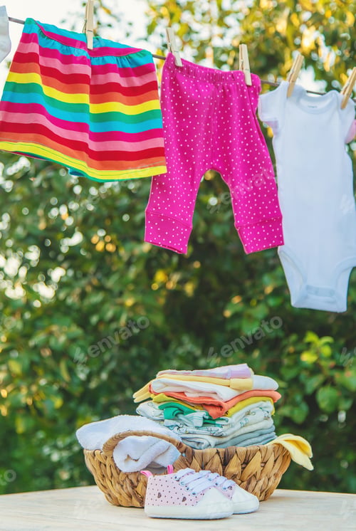 Preview: washing baby clothes. Linen dries in the fresh air. Selective focus.