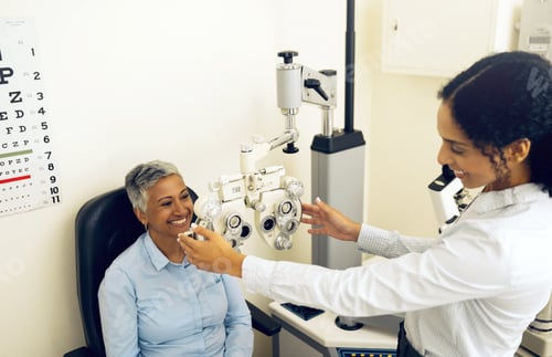 Preview: Woman, eye exam and phoropter for ophthalmologist with check, lens or vision for wellness in clinic