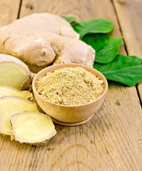Preview: Ginger powder in a bowl with the root and leaves
