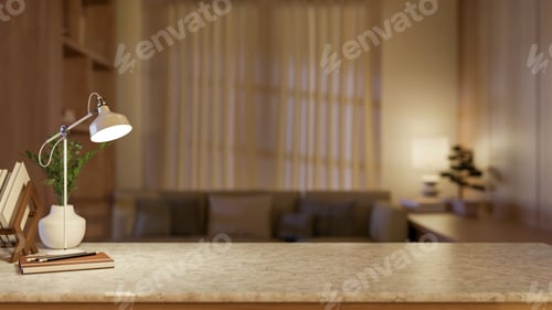 Preview: Desk lamp with book and pencils aside potted plant on marble counter table across window in dim room
