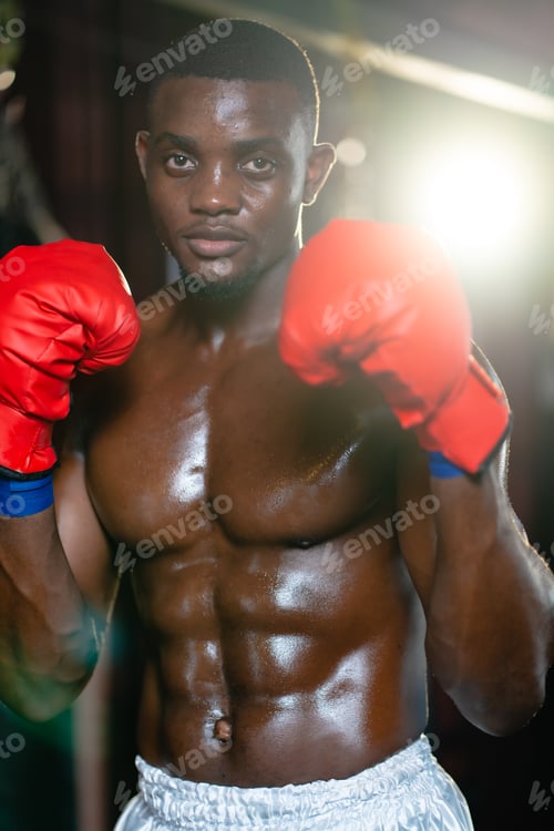 Preview: Muscular african american male boxer wearing boxing gloves, Sports workout and bodybuilding