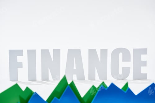 Preview: finance inscription behind green and blue statistic graphs on white background