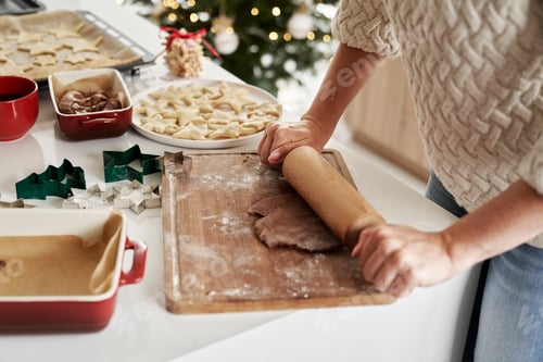 Preview: Unrecognizable woman preparing dough for the Christmas cookies