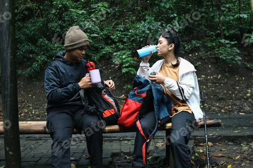 Preview: Hikers Enjoying Refreshments in a Forest Setting