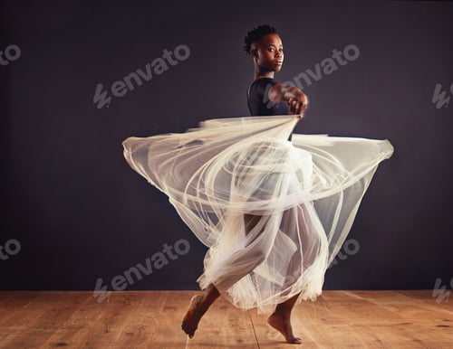 Preview: Young female contemporary dancer using a soft white white skirt for dramatic effect