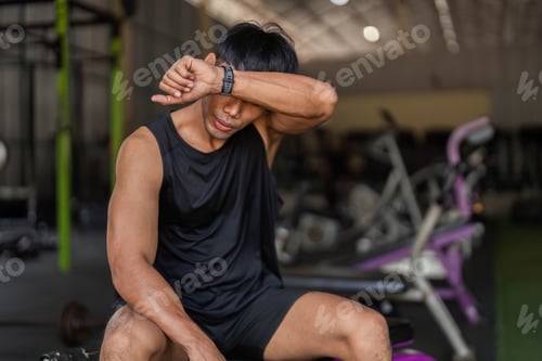 Preview: Post-Workout Reflection: Young Man in Gym After Kettlebell Session