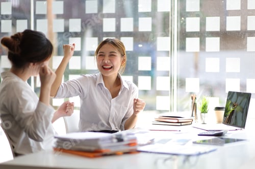 Preview: Businesswoman and office colleagues express excitement and happiness as the job is accomplished.