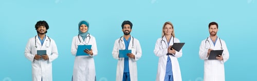 Preview: Happy adult arab and european doctors in white coats with tablets and clipboards