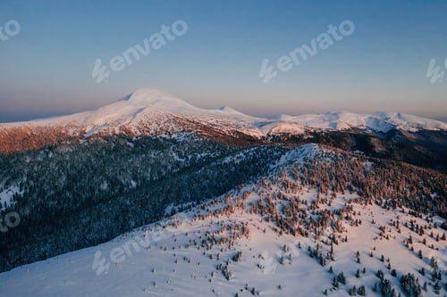 Preview: Winter aerial landscape of majestic Carpathian mountains. Background with sunset