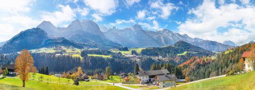 Preview: view of Alpine green fields and traditional wooden houses near Abtenau village at autumn sunny day.