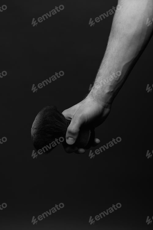 Preview: barber holding a brush for powder bw