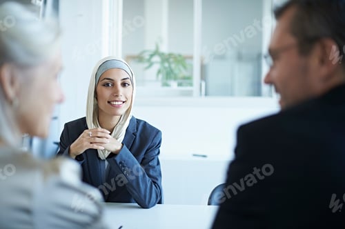 Preview: Over shoulder view of young businesswoman at interview in office