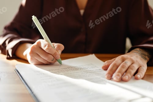 Preview: Businesswoman Signing Document Close Up
