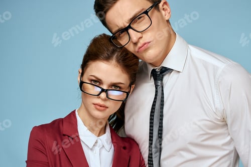 Preview: Business young couple officials office team office blue background