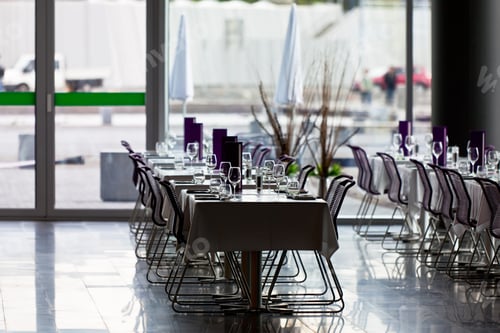 Preview: Indoor restaurant tables ready for service