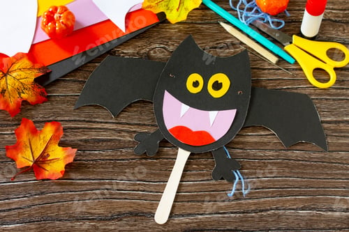 Preview: Dracola bat toy Halloween on a wooden table.