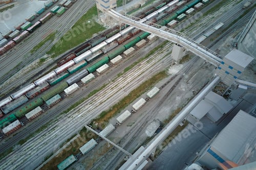Preview: Aerial view of cargo train cars loaded with construction goods at mining factory.