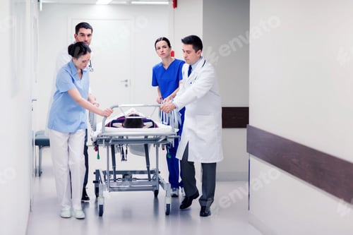 Preview: medics with woman on hospital gurney at emergency