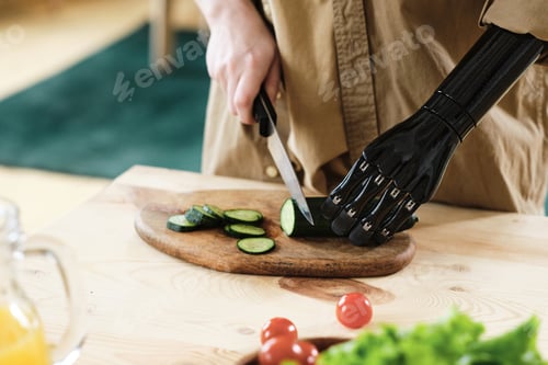 Preview: Woman with prosthesis cutting salad