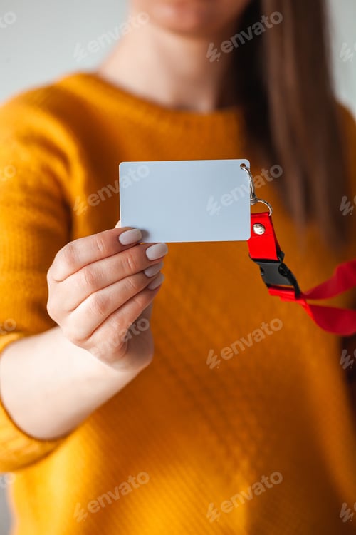 Preview: Woman holding badge name tag, with blank space mock up