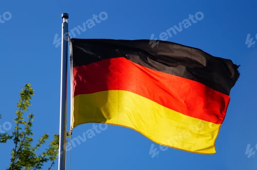 Preview: The German flag flies in the evening light.