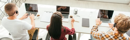Preview: panoramic shot of brokers in headsets working in call center