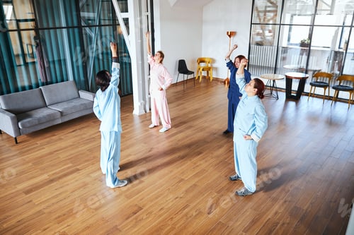 Preview: Group of people doing exercises for relaxation and meditation