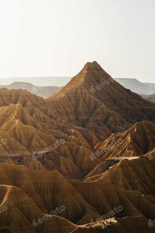 Preview: Warm sunlight illuminating castildetierra peak at sunset in bardenas reales natural park,