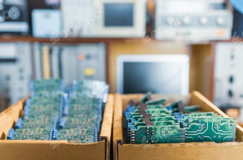 Preview: Close-up electric green embedded microcircuits in production