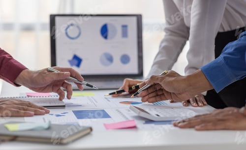 Preview: Group of confident business people point to graphs and charts to analyze market data, balance sheet,