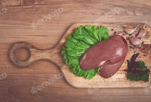Preview: raw pork kidneys, on a chopping board, close-up, top view, no people,